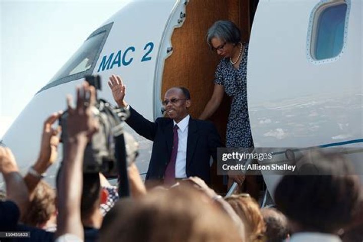 	ARISTIDE’S WIFE RETURNS TO HAITI AFTER FUNERAL	