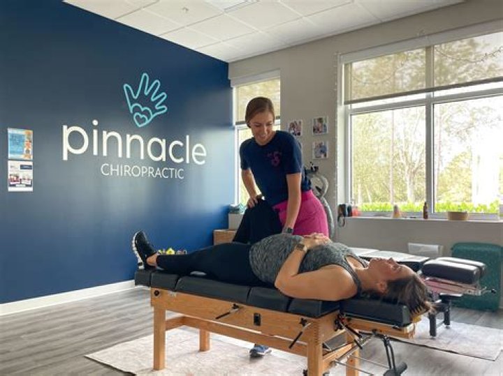 	CHIROPRACTER HOLDS KID BENEFIT	