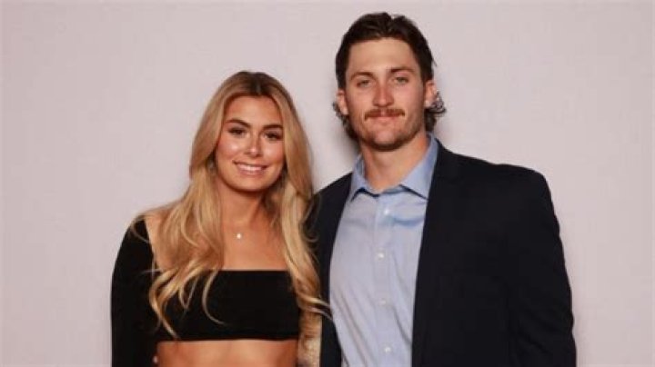 Dylan Crews and girlfriend Jane Carson relax dockside along with LSU baseball teammate
