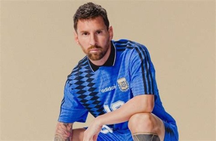 Lionel Messi wears Argentina 1994 World Cup kit and jacket by Adidas