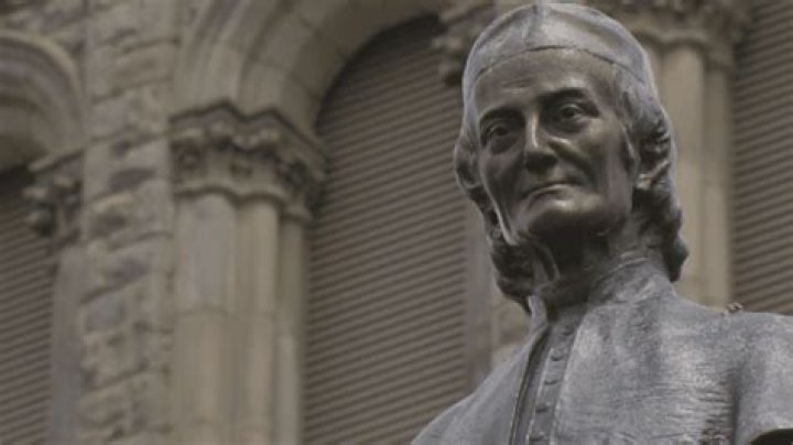 Residents recognize priest for helping build community, call for sainthood